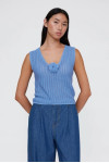 BLUE KNIT TOP WITH EMBROIDERED FLOWER